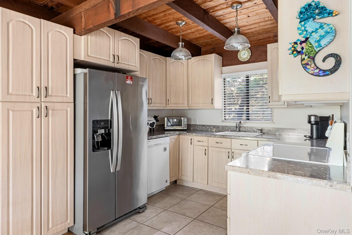 200 Clipper Road Ocean Beach, NY 11706 - Photo 5 of 29 a kitchen with stainless steel appliances granite countertop a refrigerator and a stove top oven