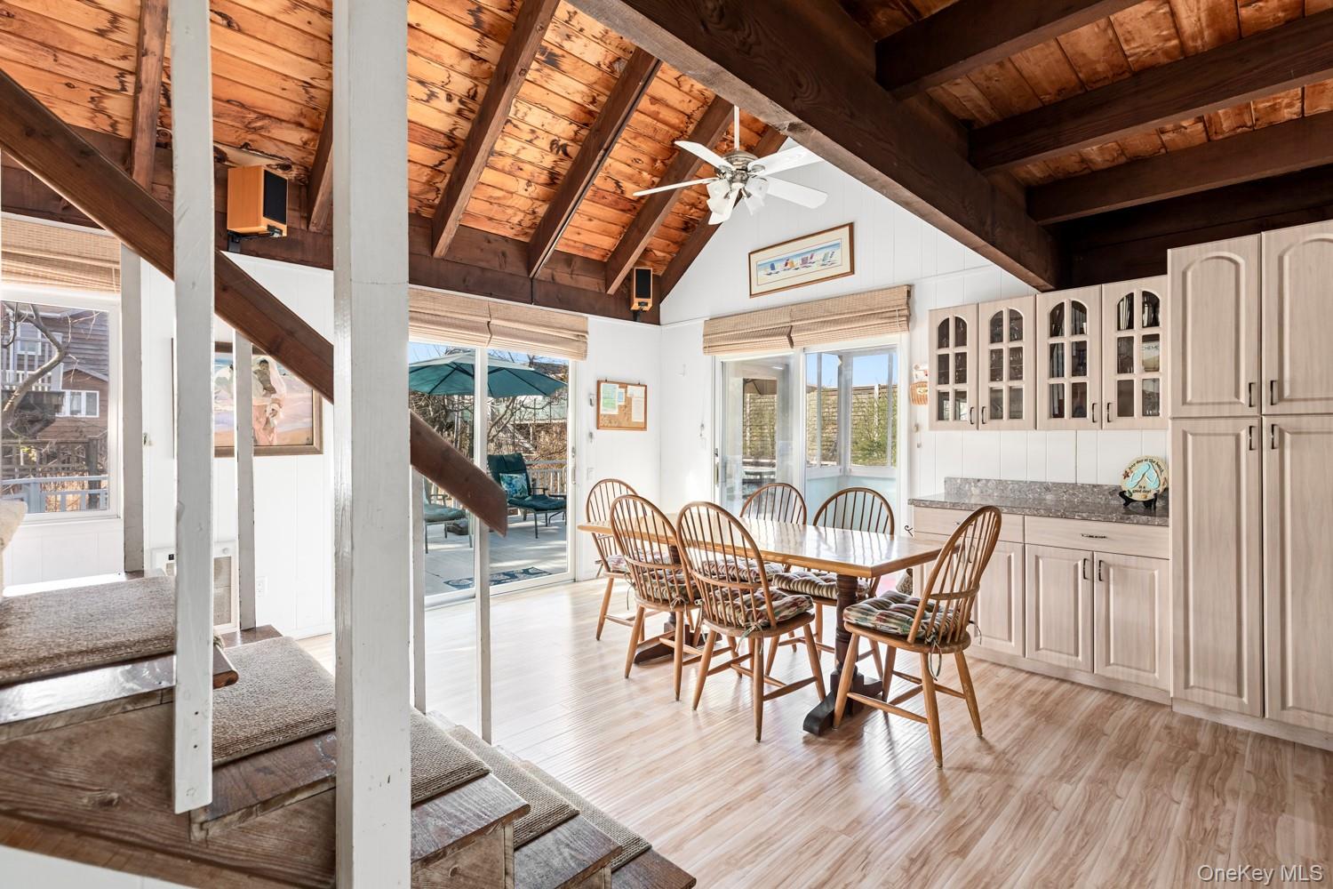 200 Clipper Road Ocean Beach, NY 11706 - Photo 8 of 29 a view of a dining room with furniture window and wooden floor