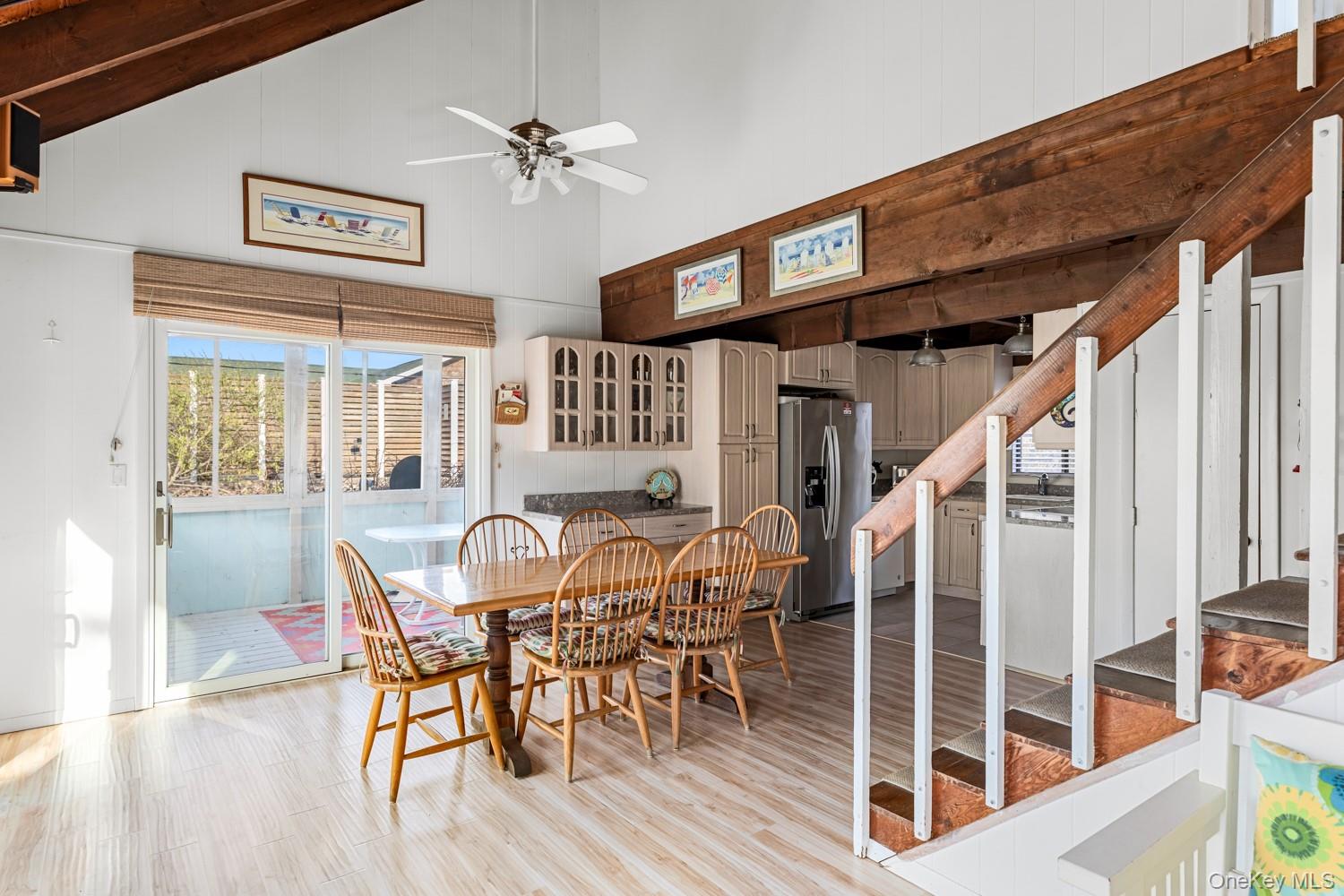 200 Clipper Road Ocean Beach, NY 11706 - Photo 9 of 29 a view of a dining room with furniture and wooden floor