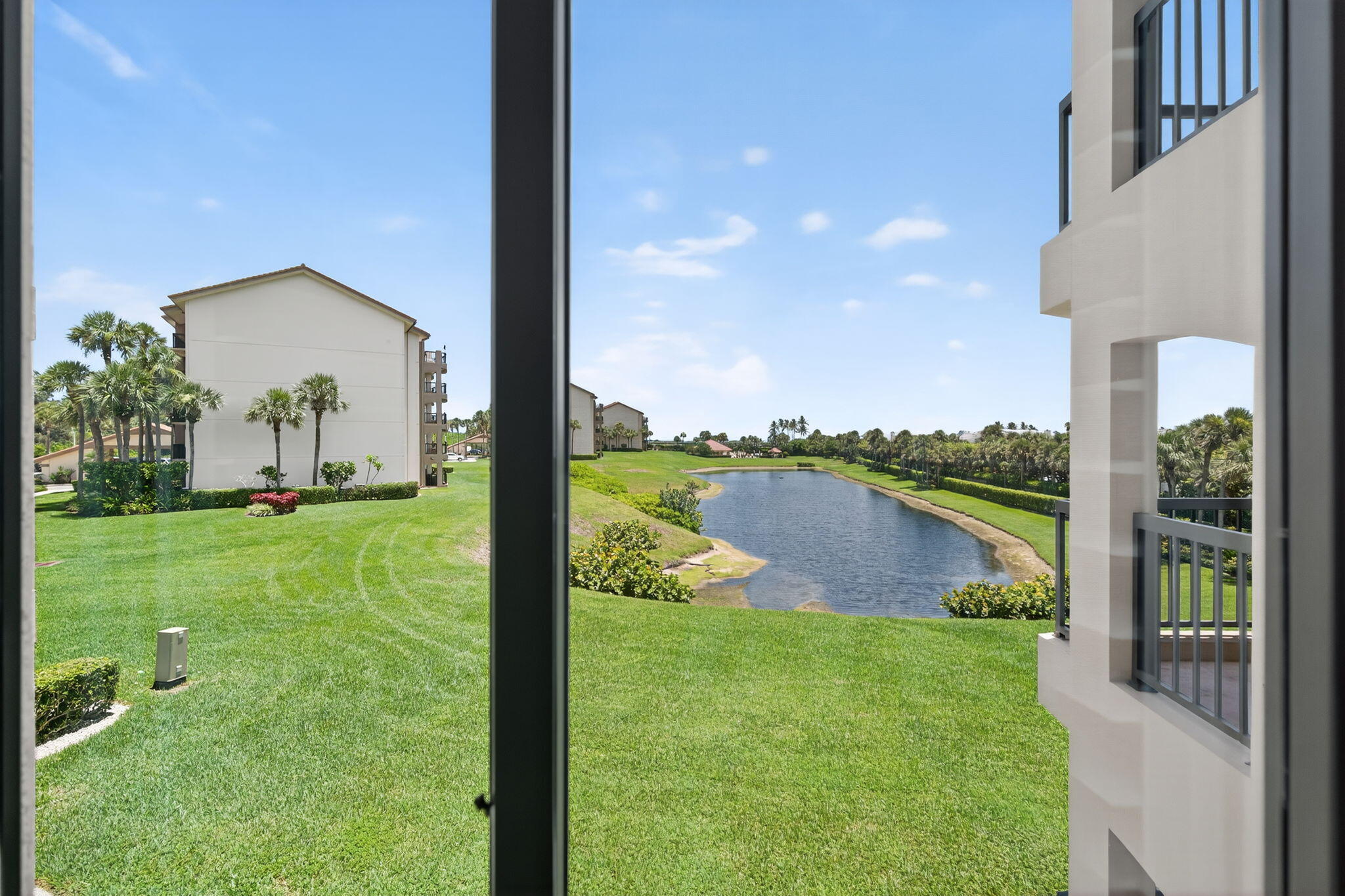 401 Ocean Bluffs Boulevard, Unit 205 Jupiter, FL 33477 - Photo 20 of 42 a view of a garden from a patio