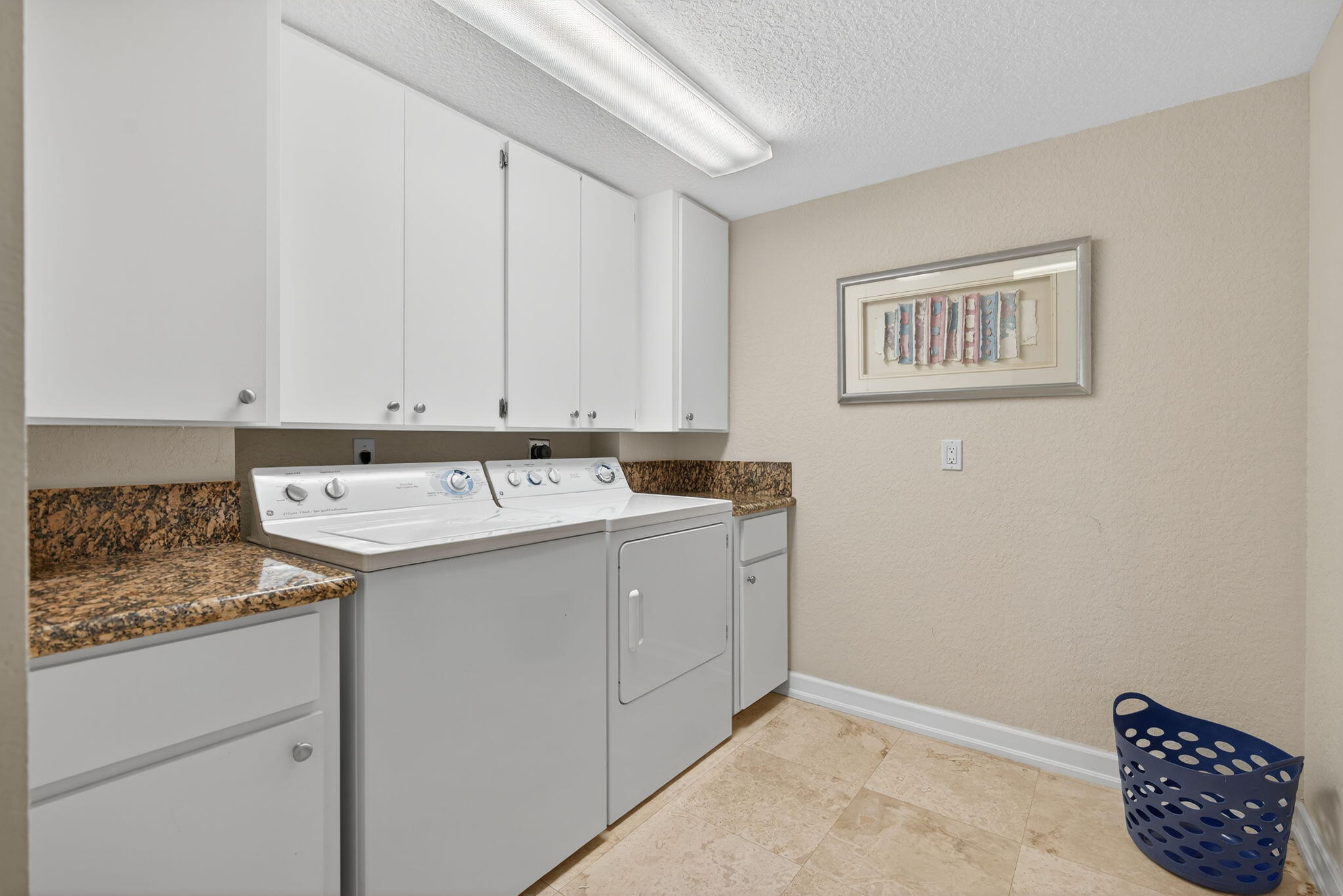 401 Ocean Bluffs Boulevard, Unit 205 Jupiter, FL 33477 - Photo 28 of 42 a utility room with a sink a cabinetry and utility