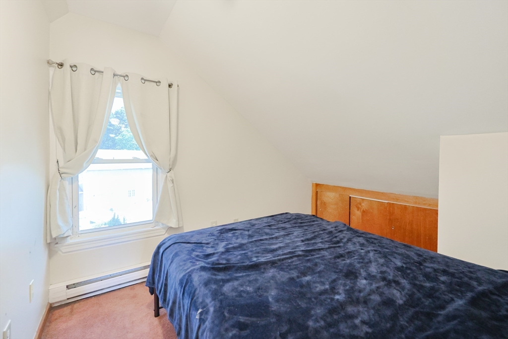 107 Lake Street, Unit B Webster, MA 01570 - Photo 12 of 42 a bedroom with a bed and a window