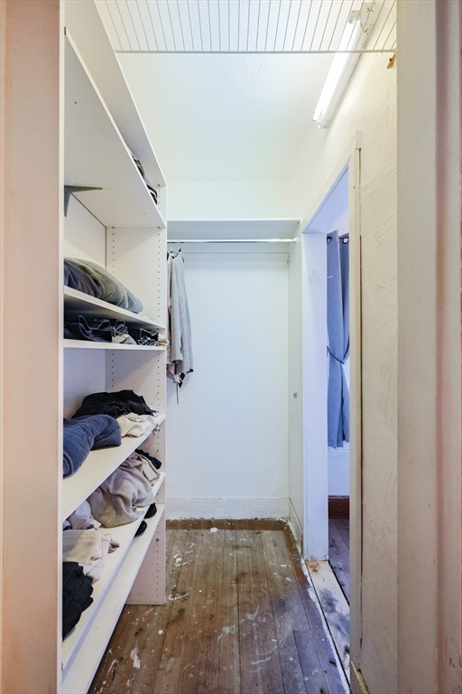 107 Lake Street, Unit B Webster, MA 01570 - Photo 23 of 42 a view of walk in closet with clothes and shoes