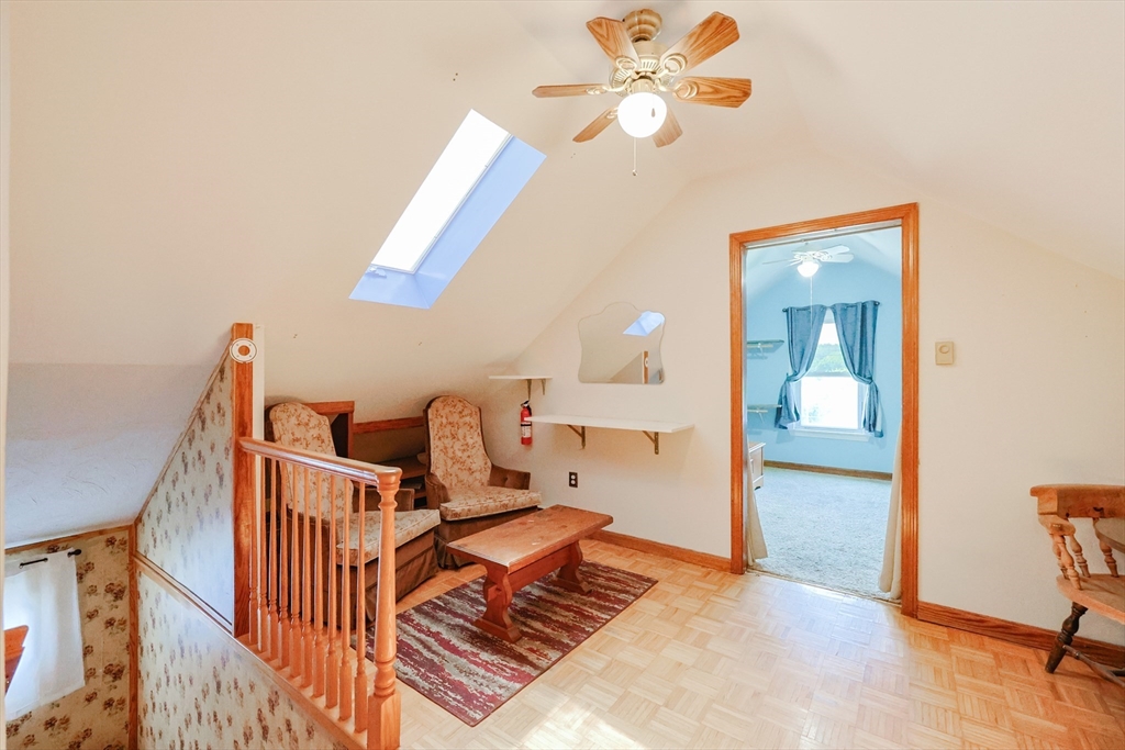 107 Lake Street, Unit B Webster, MA 01570 - Photo 25 of 42 a bedroom with a bed and a chandelier