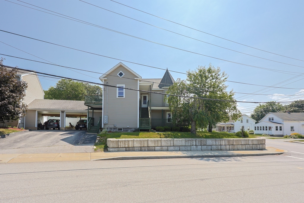 107 Lake Street, Unit B Webster, MA 01570 - Photo 34 of 42 a view of a house with a yard porch and sitting area