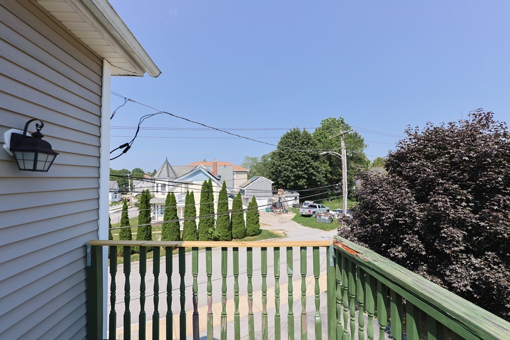 107 Lake Street, Unit B Webster, MA 01570 - Photo 38 of 42 a view of a balcony with wooden fence and floor