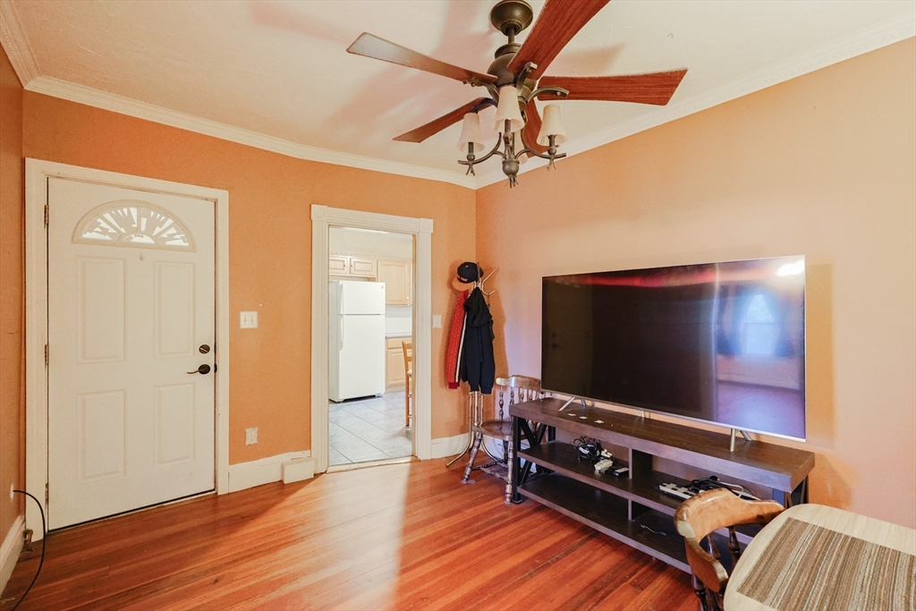 107 Lake Street, Unit B Webster, MA 01570 - Photo 5 of 42 a living room with furniture and a flat screen tv
