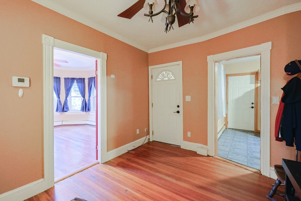 107 Lake Street, Unit B Webster, MA 01570 - Photo 7 of 42 a view of a hallway with wooden floor and closet