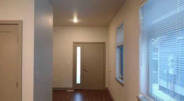 a view of a livingroom with wooden floor