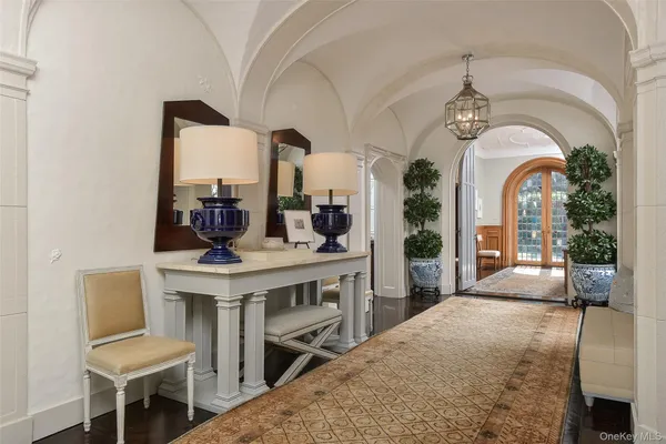 a very nice looking room with a large window and chandelier