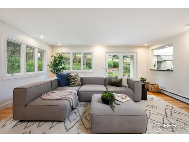 a living room with furniture and windows
