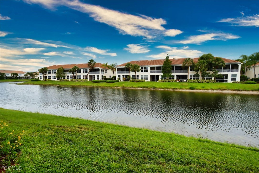 a view of a lake with houses in the background
