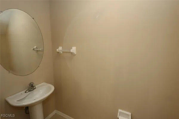 a bathroom with a sink and mirror