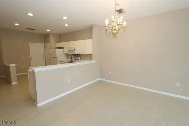 a view of a kitchen with a sink