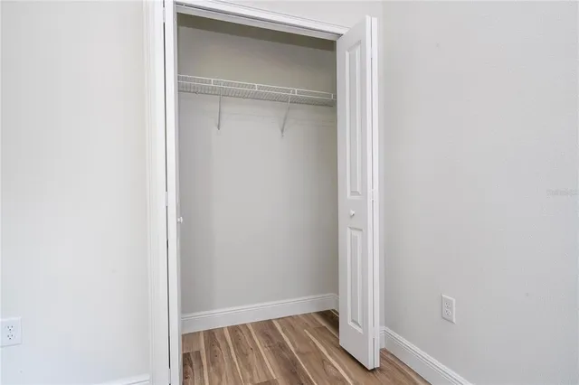 an aerial view of residential houses with outdoor space and swimming pool