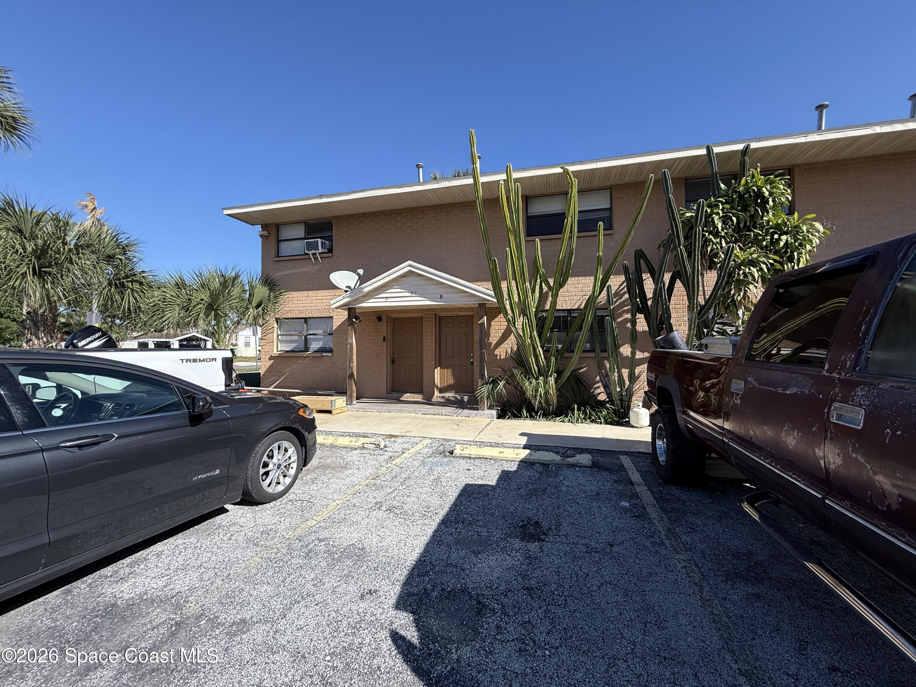 27 Ella Street, Unit B Melbourne, FL 32935 - Photo 2 of 18 a view of a car park in front of a house
