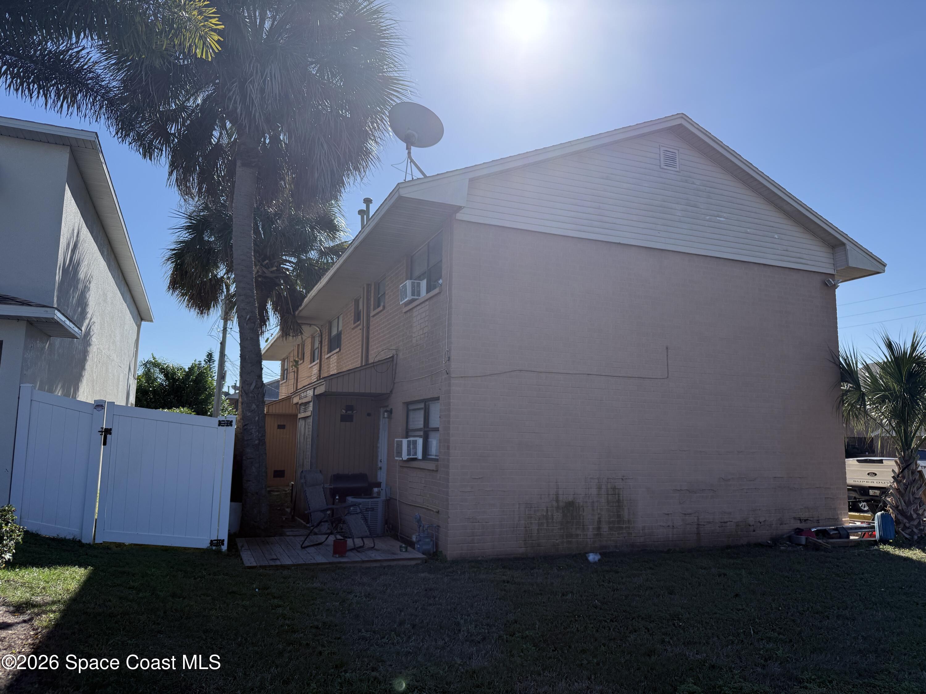 27 Ella Street, Unit B Melbourne, FL 32935 - Photo 5 of 18 a house view with a backyard space