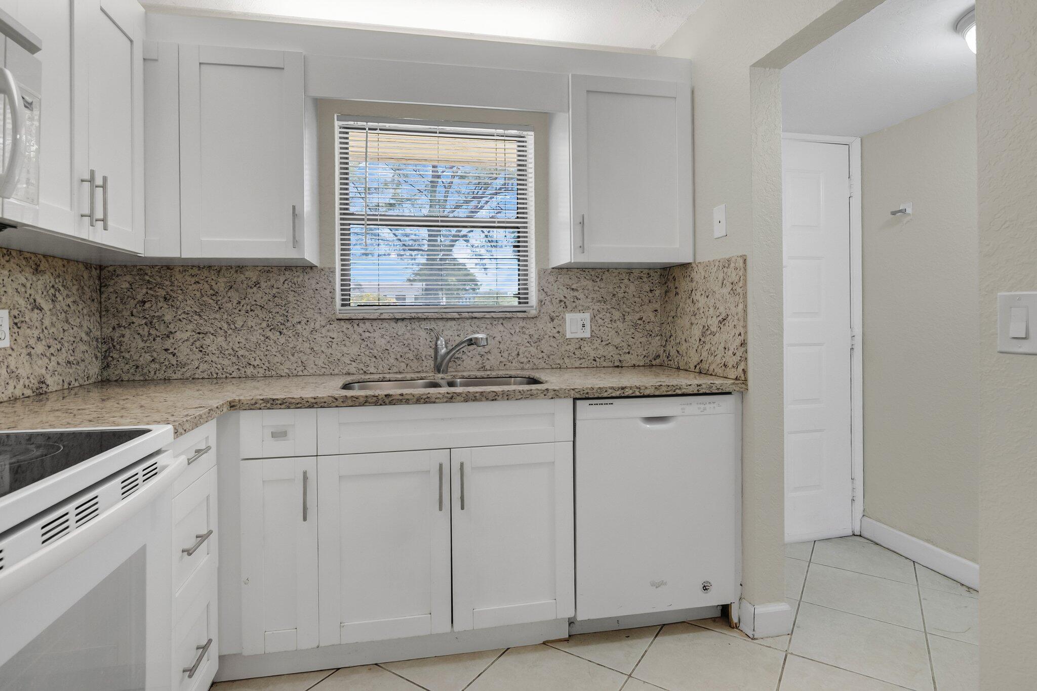 21911 Lake Forest Circle, Unit 103 Boca Raton, FL 33433 - Photo 6 of 24 Kitchen View 2