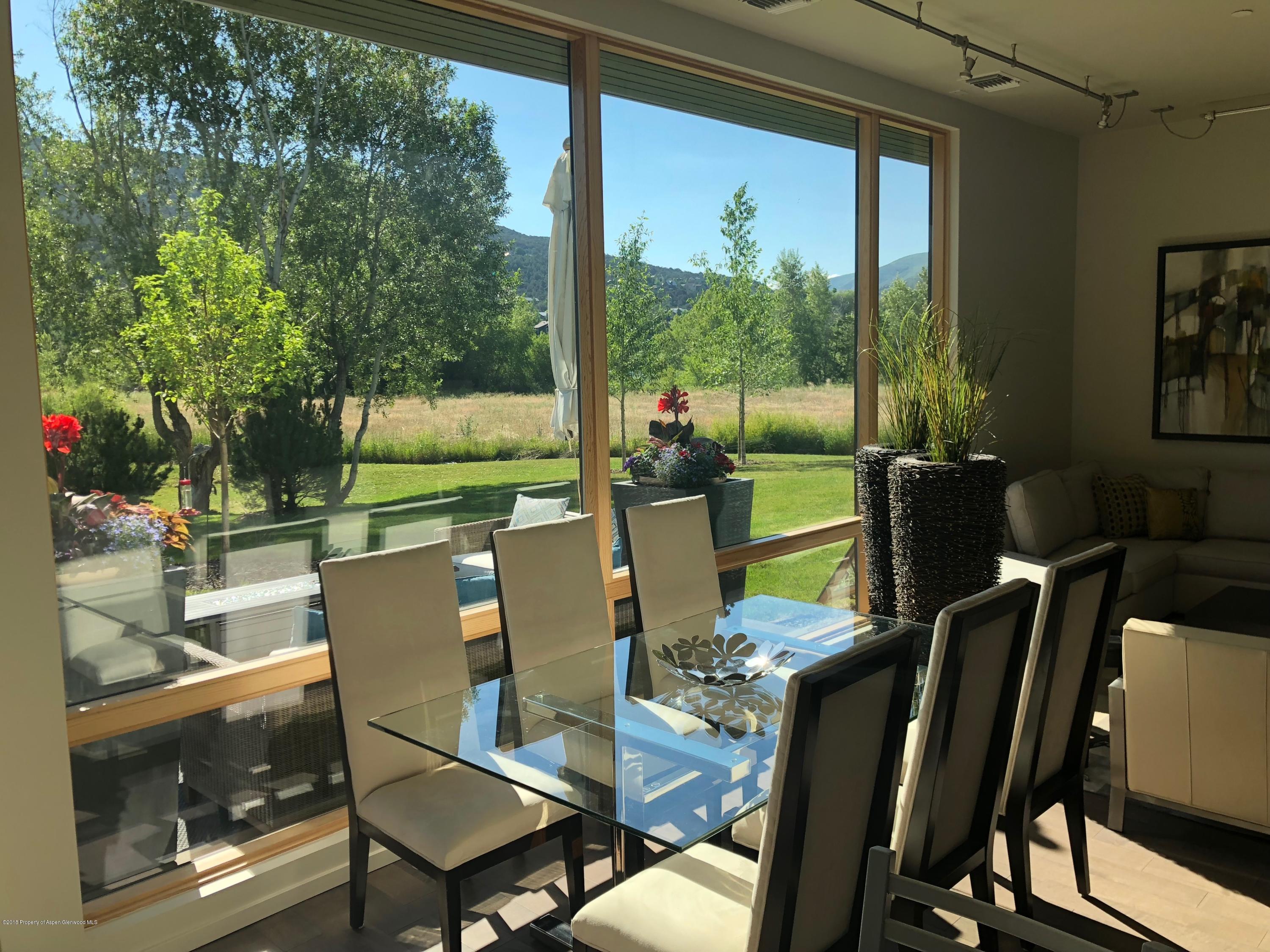 104 Evans Road, Unit 104 Basalt, CO 81621 - Photo 9 of 20 a view of a dining room with furniture window and outside view