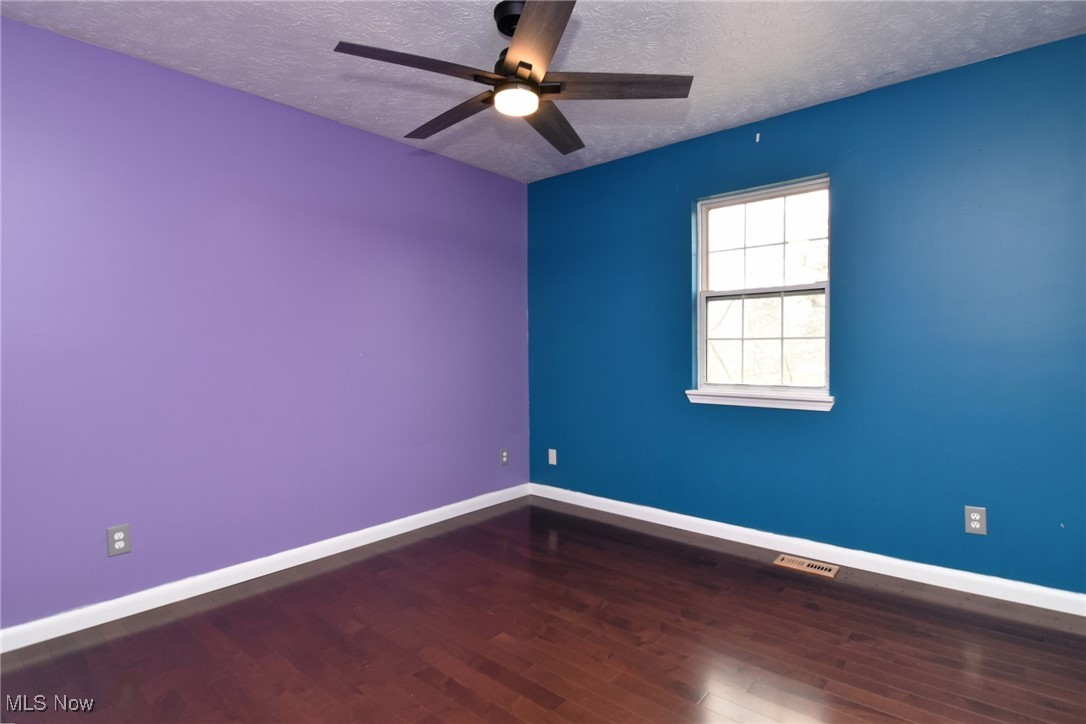 4985 Corliss Road Cleveland, OH 44124 - Photo 24 of 33 Bedroom with new hardwood floors - ceiling fan