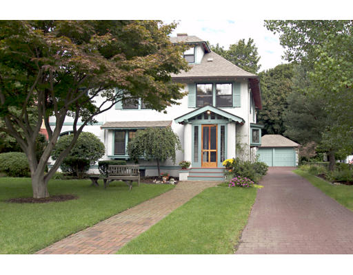 22 Lakeview Road Winchester, MA 01890 - Photo 1 of 12 a front view of a house with a garden and plants