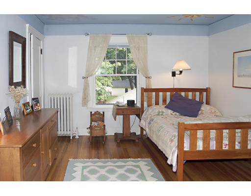 22 Lakeview Road Winchester, MA 01890 - Photo 10 of 12 a bedroom with a bed and wooden floor
