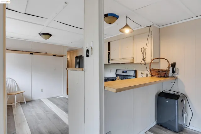 a living room with a couch and a chandelier