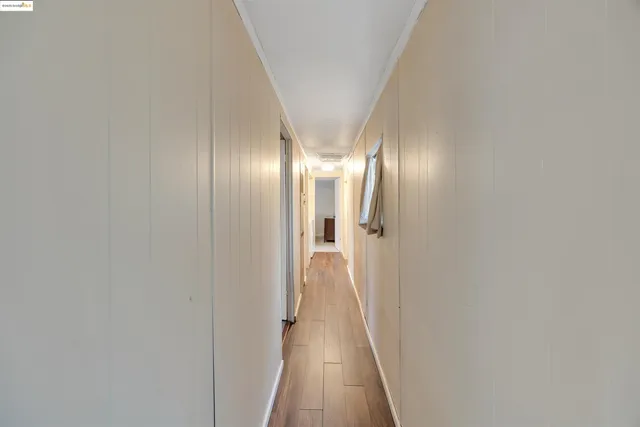 a view of a kitchen with a sink and window