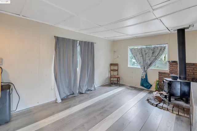 a view of a livingroom with hardwood floor and a window