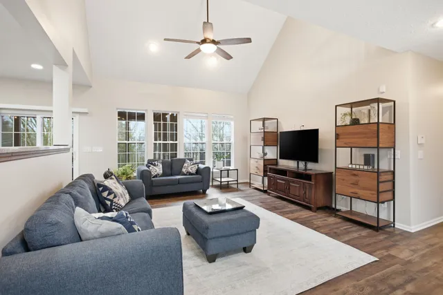 a living room with furniture and a flat screen tv