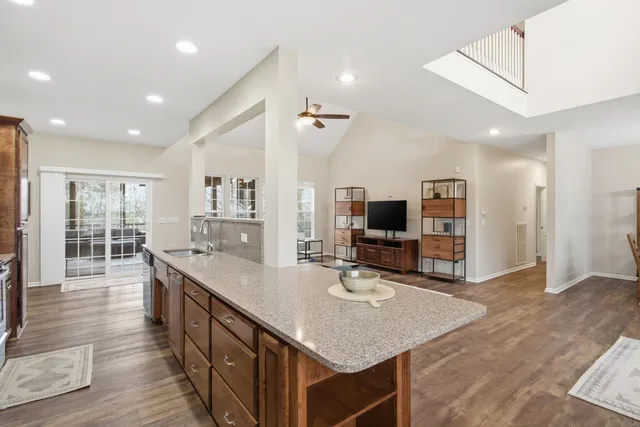 a kitchen with sink refrigerator and microwave