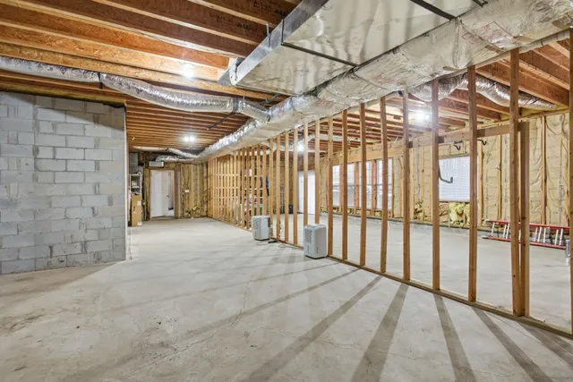 a view of a room with wooden walls