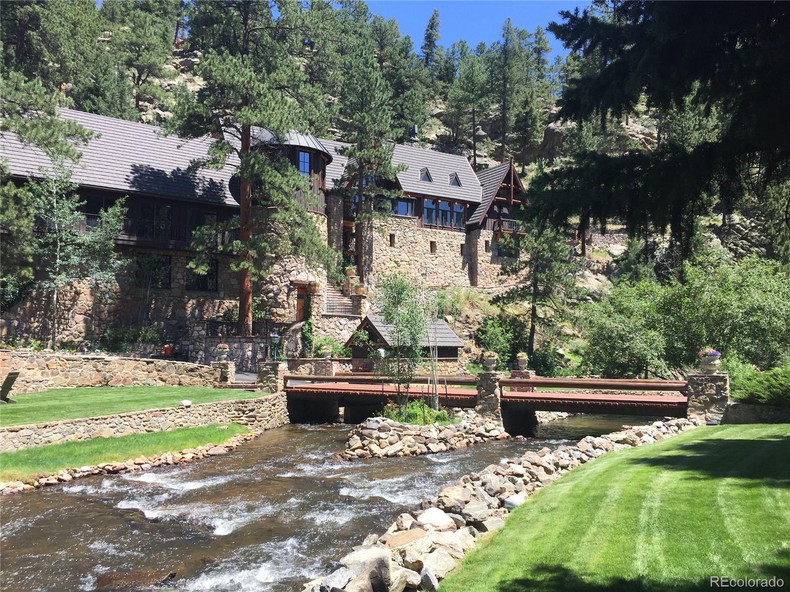 a backyard of a house with yard and outdoor seating