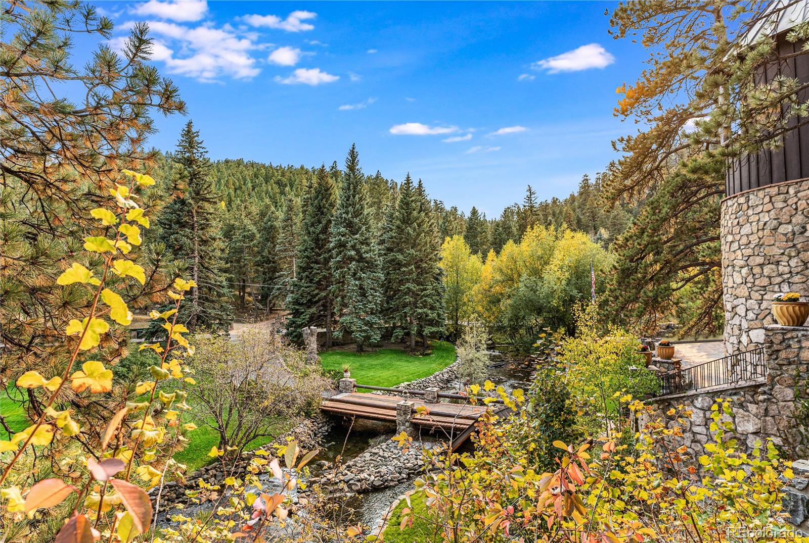30403 Upper Bear Creek Road Evergreen, CO 80439 - Photo 32 of 40 a view of outdoor space with garden view