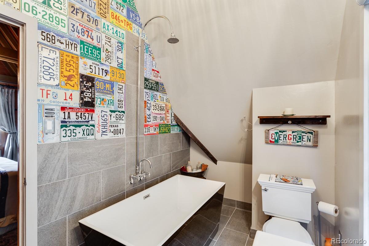 30403 Upper Bear Creek Road Evergreen, CO 80439 - Photo 34 of 40 a bathroom with a toilet and a sink