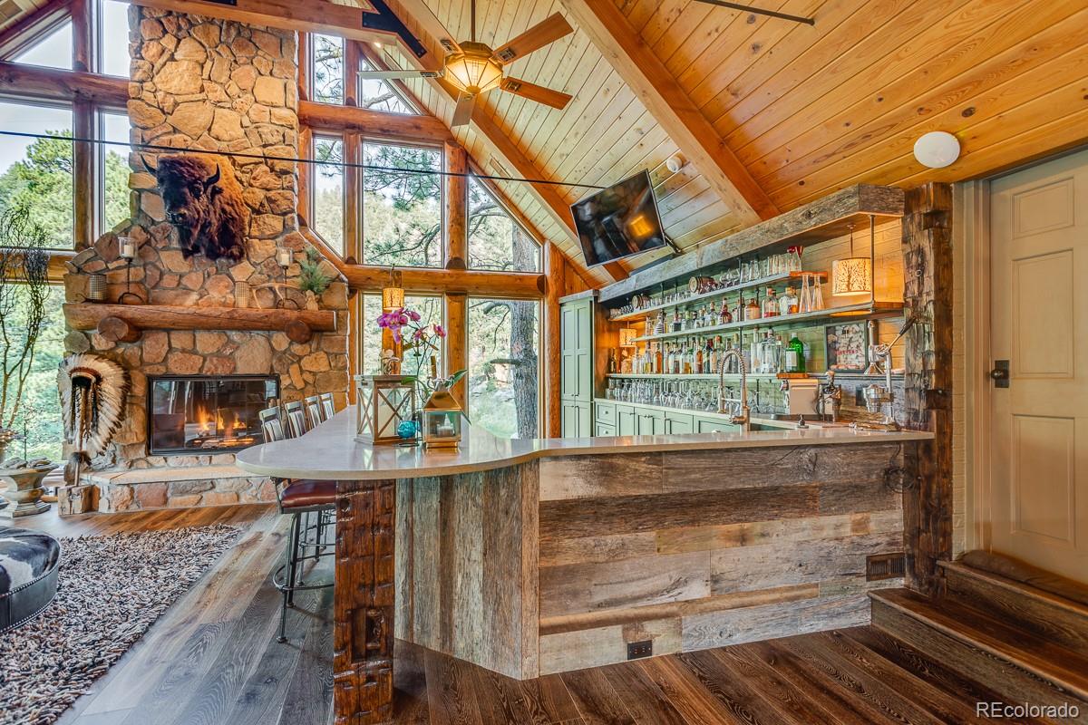 30403 Upper Bear Creek Road Evergreen, CO 80439 - Photo 7 of 40 a view of entryway and hall with wooden floor