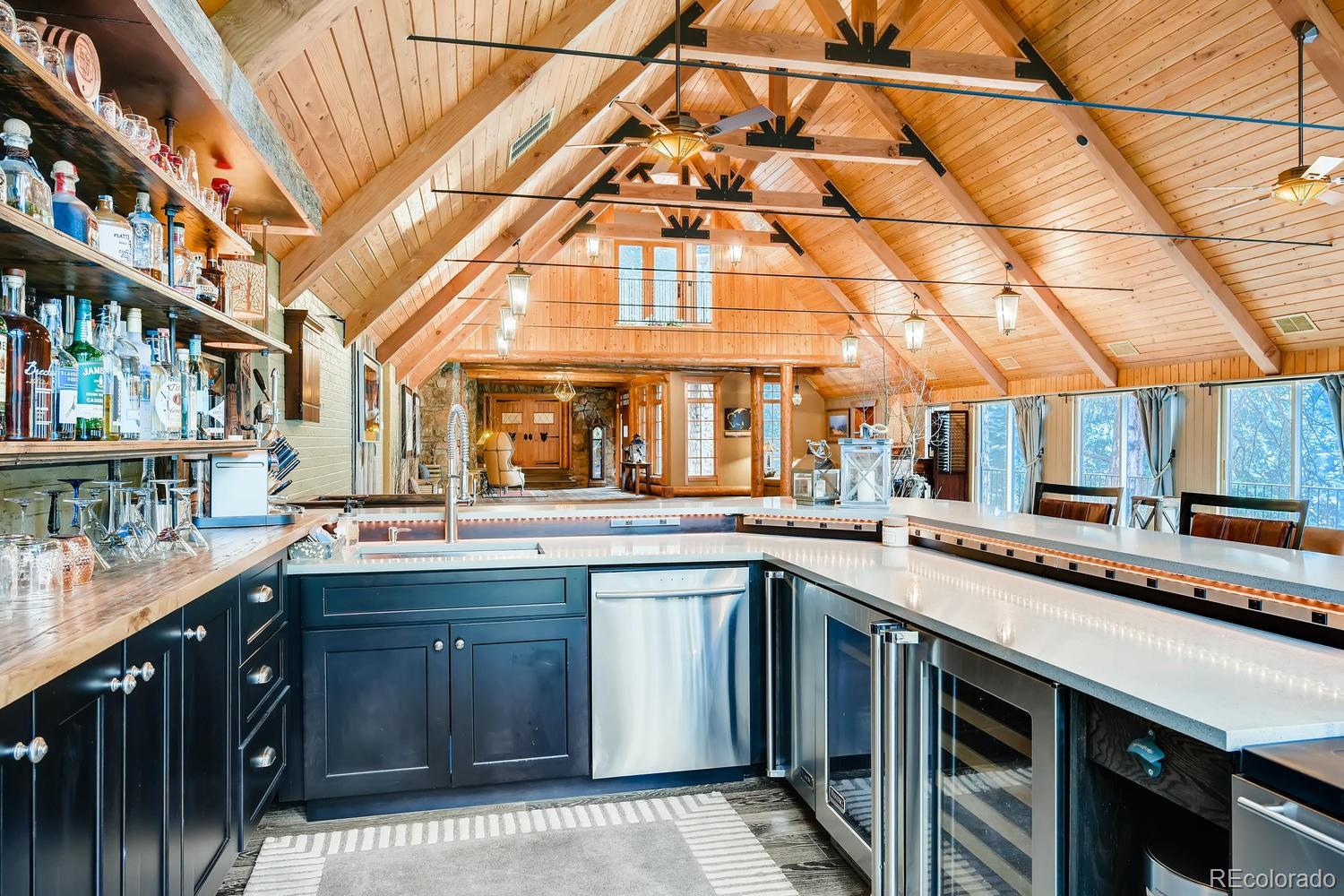 30403 Upper Bear Creek Road Evergreen, CO 80439 - Photo 9 of 40 a kitchen with a sink and cabinets