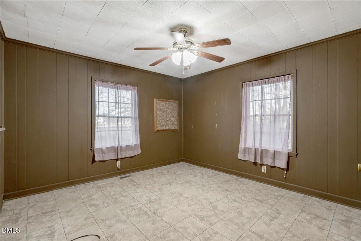 4049 Highway 58 Buffalo Junction, VA 24529 - Photo 14 of 21 an empty room with chandelier fan and windows