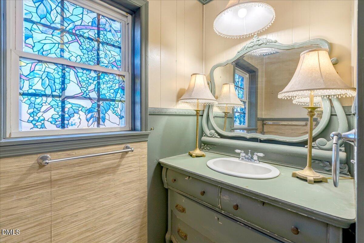 4049 Highway 58 Buffalo Junction, VA 24529 - Photo 16 of 21 a bathroom with a sink vanity and a mirror