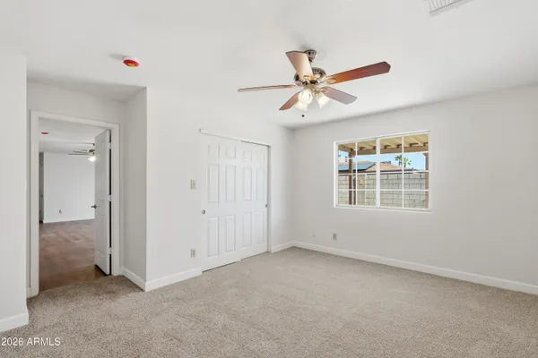 a view of an empty room with a window