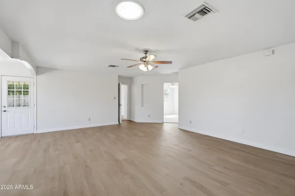 a view of an empty room with a window
