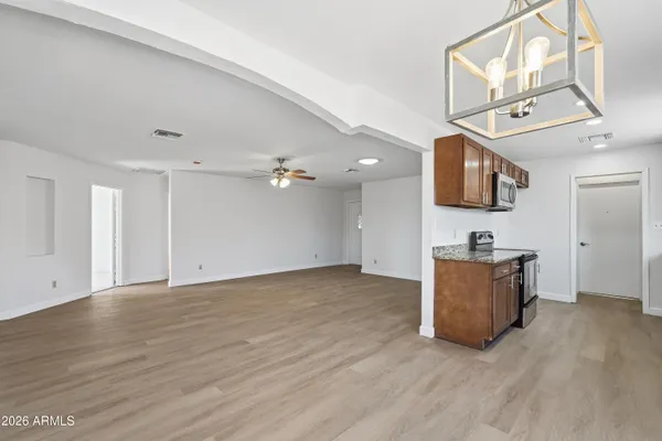 a view of a kitchen with a sink and a microwave
