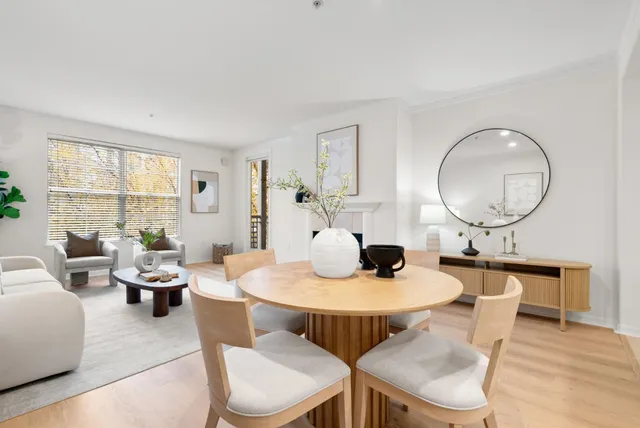 a dining room with furniture and window
