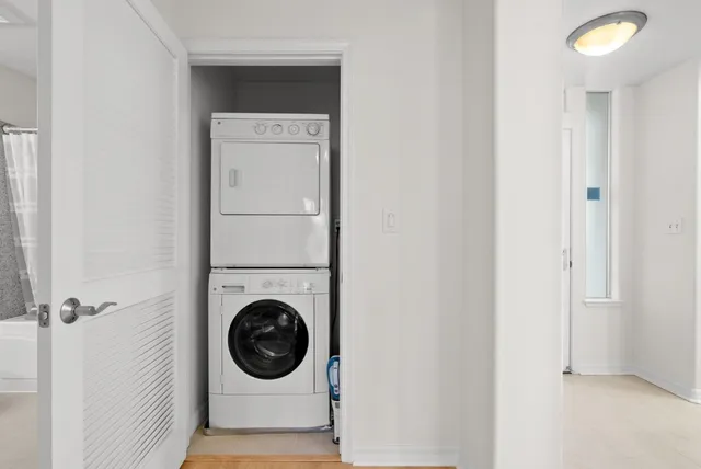 a spacious bedroom with a bed and a couch