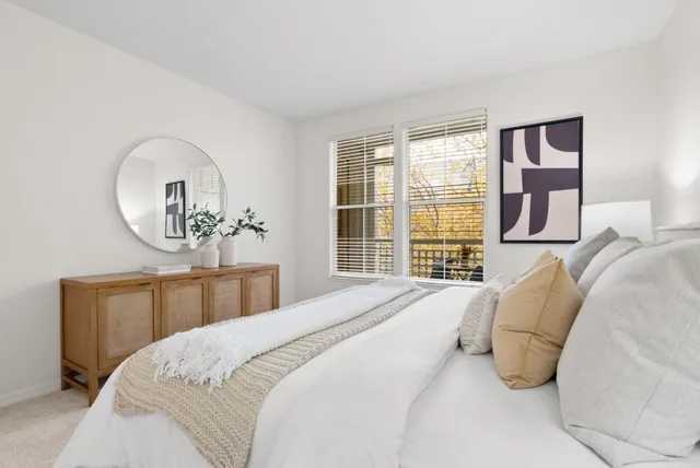 a spacious bedroom with a large bed and a window