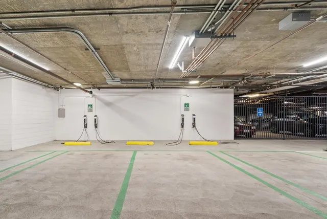 a front view of a residential apartment building with a yard