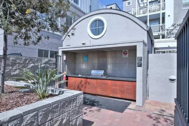 a living room with furniture a projector and a flat screen tv