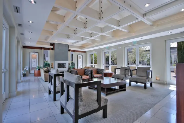 a large kitchen with a large counter top furniture and a dining table