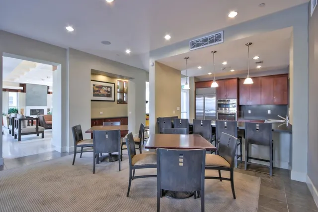 a view of a a dining room with furniture window and wooden floor