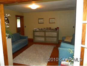 519 Limestone Road Verona, VA 24482 - Photo 4 of 10 a living room with a couch and a coffee table